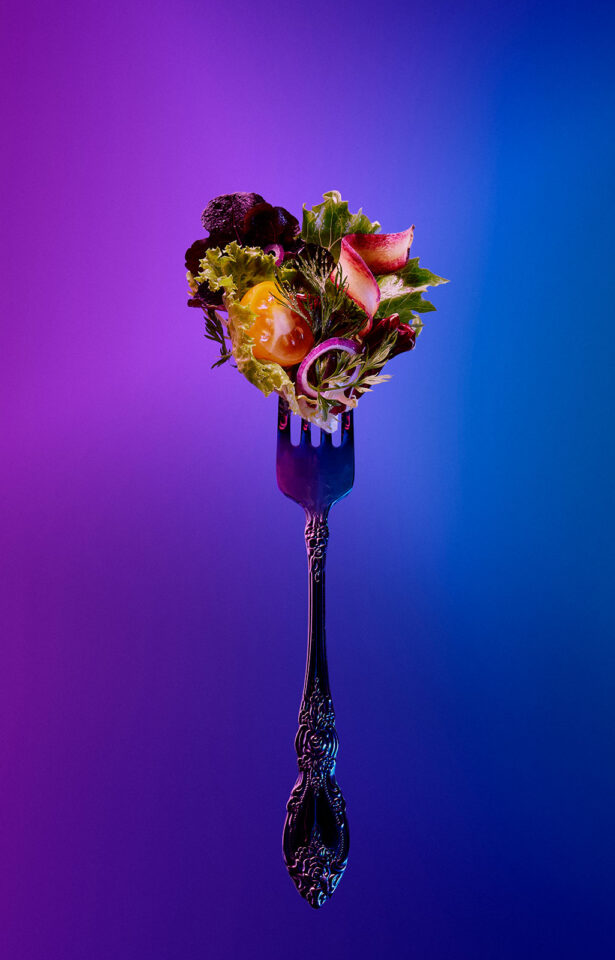 salad bite on a fork bold colorful food photography